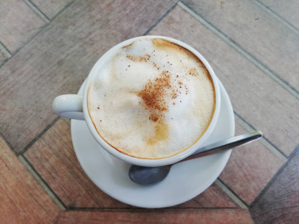 istock Cup of coffee with teaspoon on the table 1040245534