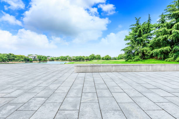 istock Empty square floor and green forest natural scenery in the city park 1040255194