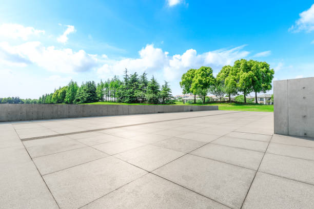 istock Empty square floor and green forest natural scenery in the city park 1040258164