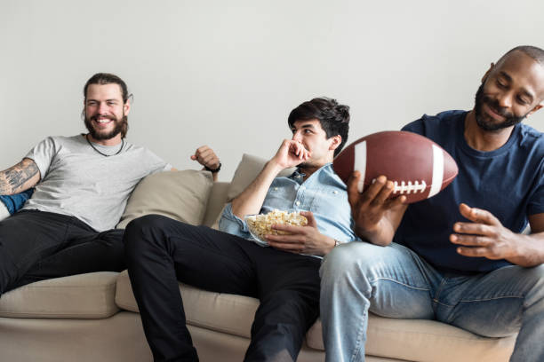 istock Friends cheering sport league together 1040260064