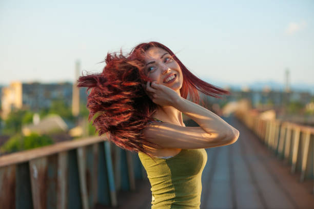 Cute Redhead Female Looking Towards The Future While Relaxing On Lake