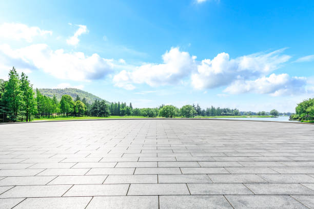 istock Empty square floor and green forest natural scenery in the city park 1040264798