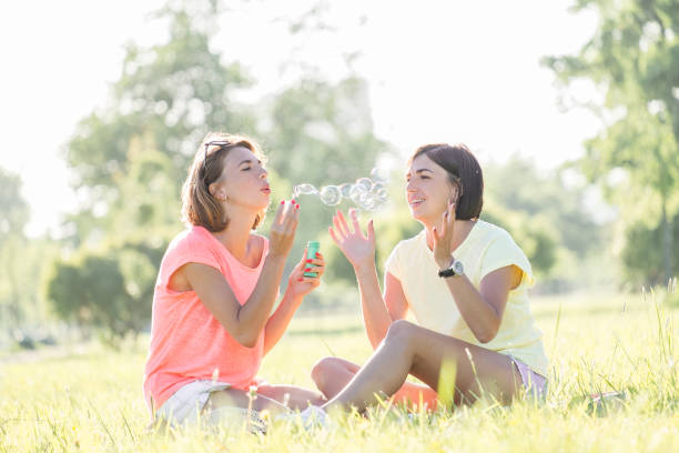 istock Two girls on grass at summertime 1040266780