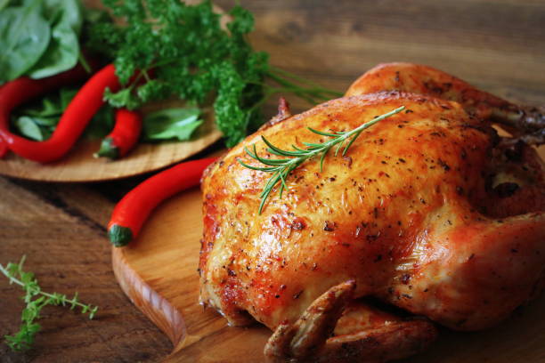 istock Whole roasted chicken on cutting board 1040270588