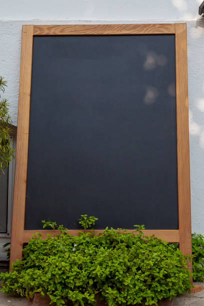 istock Empty wooden chalkboard display for restaurant menus 1040280108