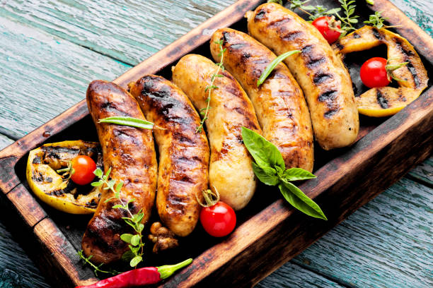istock Grilled sausages on cutting board 1040280720