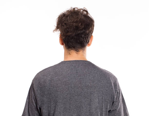 istock Young man with curly hair back portrait 1040284258