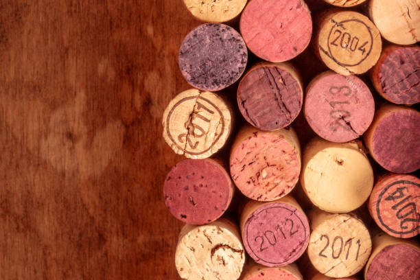 istock Wine corks background, overhead photo of red and white wine corks with copy space 1040286052