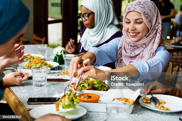 Islamic Women Friends Dining Together With Happiness Stock Photo - Download Image Now
