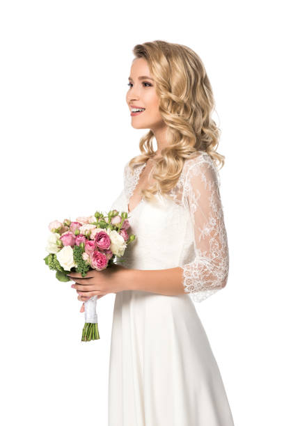 istock happy bride holding bouquet and looking away isolated on white 1040288354