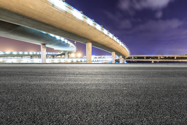 istock Asphalt road and modern bridge building scenery at night 1040289622