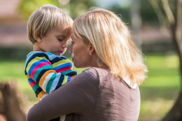 istock Mother and baby boy in park 1040300450