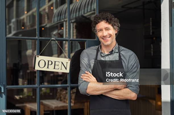 Owner Standing Outside Restaurant Stock Photo - Download Image Now - Owner, Restaurant, Store