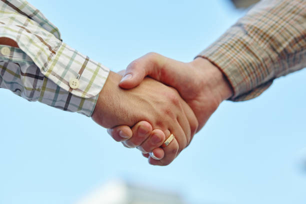 istock a businesspeople shaking hands, making an agreement. 1040304526