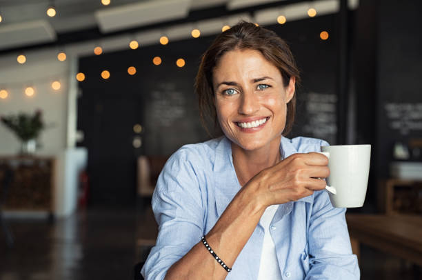 istock Smiling mature woman drinking coffee 1040304588