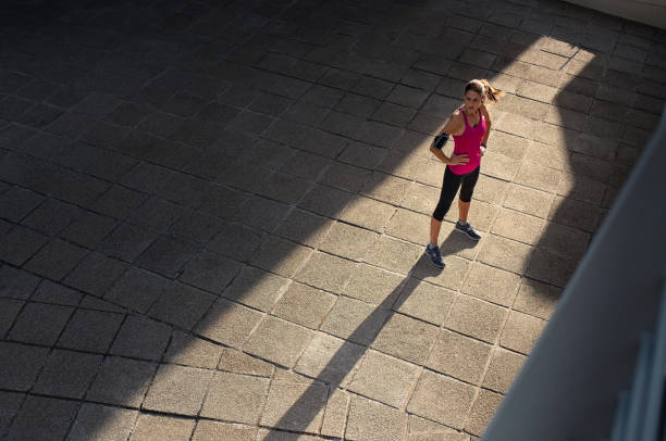 istock Fitness woman resting after jogging 1040304982