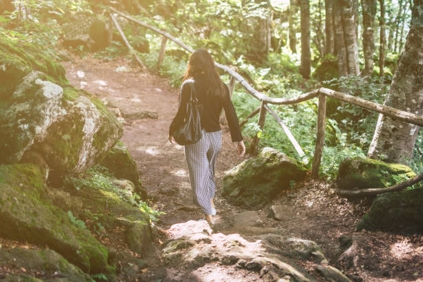 istock Woman Walking on Mountain Pathway 1040305106