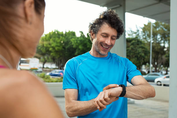 istock Mature man checking time on smartwatch 1040305304