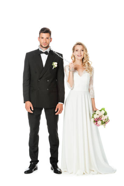 istock beautiful young bride with chain and leashed groom looking at camera isolated on white 1040307744