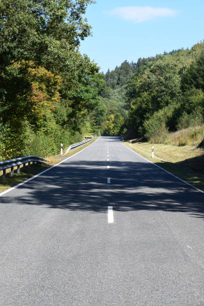 istock country road in autumn 1040307950
