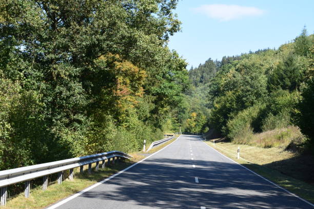 istock country road in autumn 1040308262