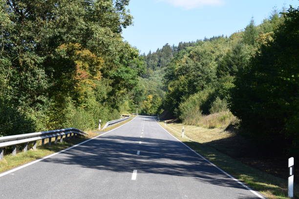 istock country road in autumn 1040308792