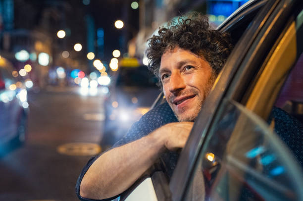 Happy man looking the city at night