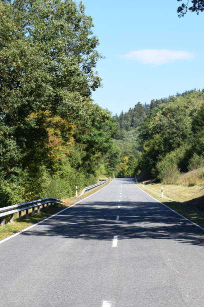 istock country road in autumn 1040309148