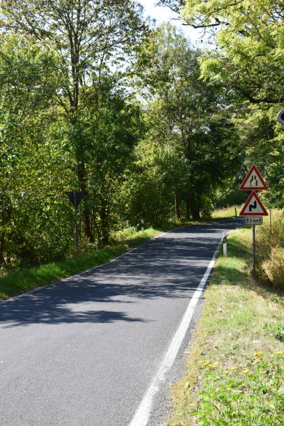 istock country road in autumn 1040312296