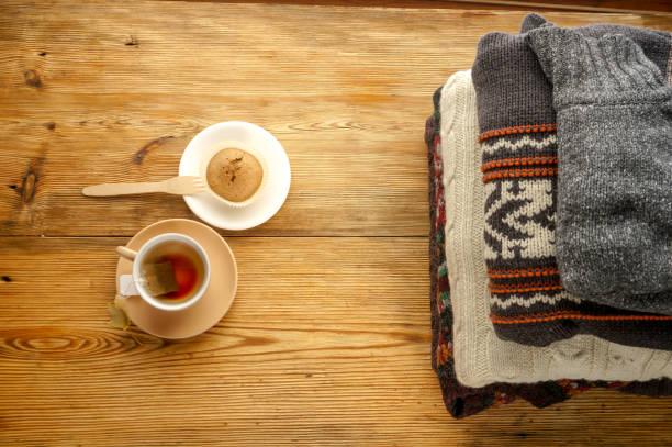 istock Cup of tea and pile of sweaters 1040313318