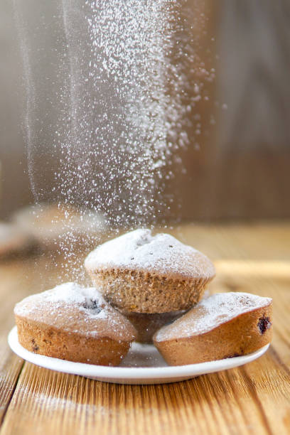 istock Holiday pastry muffins with falling suger powder 1040319404