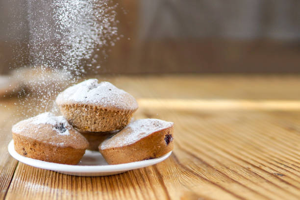 istock Holiday pastry muffins with falling suger powder 1040319408