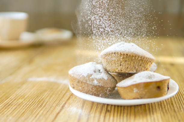 istock Holiday pastry muffins with falling suger powder 1040319428