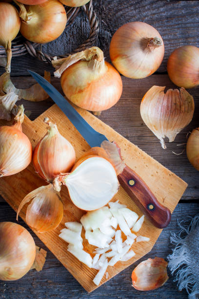 istock Finely chopped onions on a wooden table, selective focus 1040324018