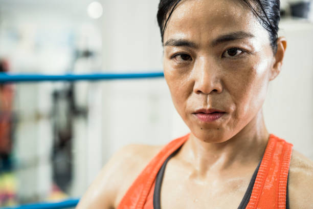 istock Female boxer having a sports training in a gym 1040324110