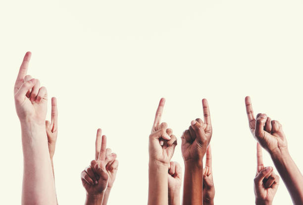 istock Large mixed group of hands raised, pointing upwards 1040324330