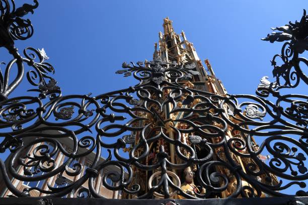 Nuremberg city in Germany (region of Middle Franconia). Ornaments at Schoener Brunnen (The Beautiful Fountain). Lucky ring visible at the bottom.