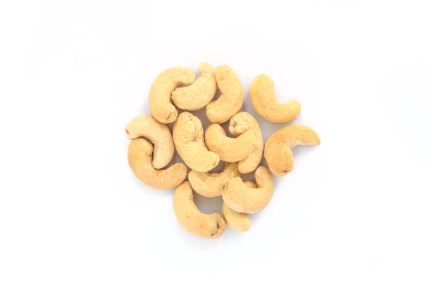 istock heap cashews top view on white background. 1040330700