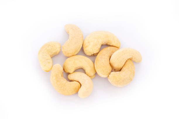 istock heap cashews on white background. 1040337428