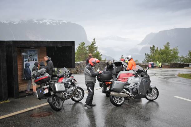 Norway motorcycle tour Motorcyclists visit the Stegastein platform - Aurlandsfjord fiord overlook in Norway. Norway had almost 5 million foreign visitors in 2011. stegastein viewpoint stock pictures, royalty-free photos & images