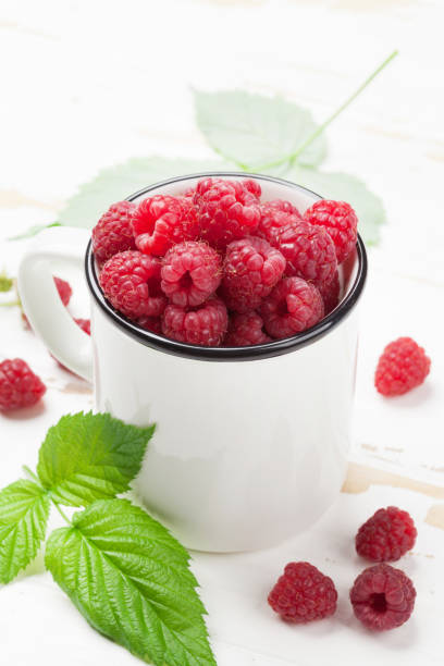 istock Cup of ripe raspberries 1040343202