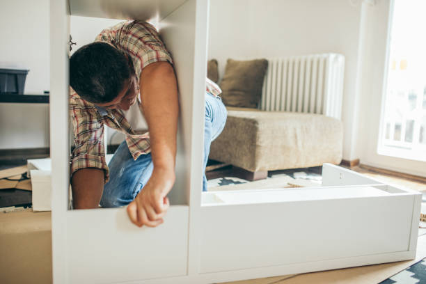 istock Single father is assembling furniture 1040357038