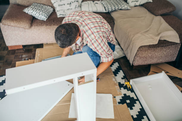 istock Single father is assembling furniture 1040359310