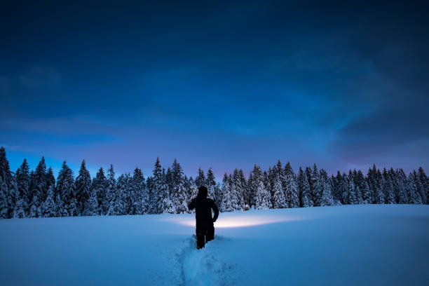 Winter Adventure Night hiking in winter conditions. deep snow stock pictures, royalty-free photos & images