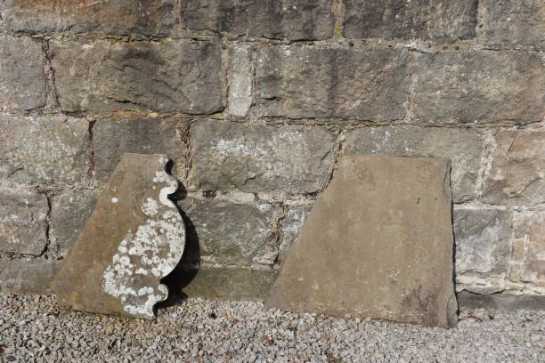 istock Old gravestone tombstone in wall 1040375060