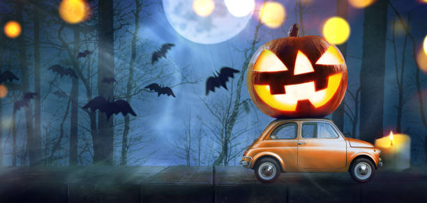 Halloween pumpkin on car stock photo