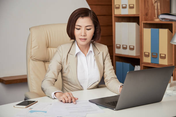 istock Ethnic businesswoman working with paper 1040385770