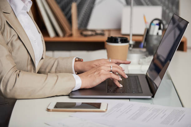 istock Crop businesswoman using laptop 1040385772