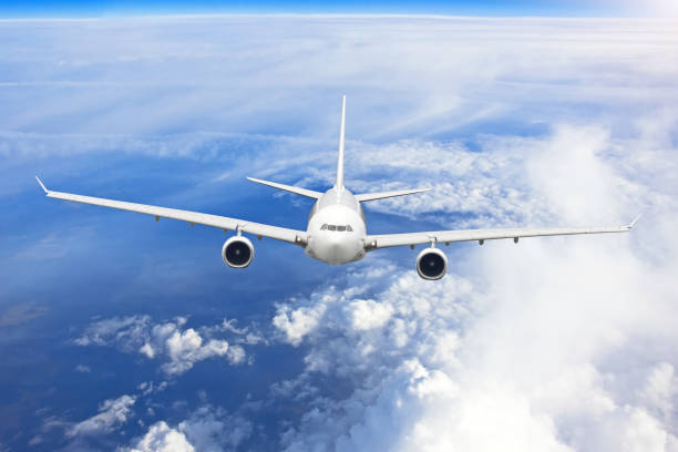 istock Airplane is gaining altitude flying out of dense clouds. 1040385818