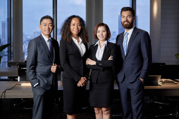 istock Group of young smiling businesspeople 1040386072